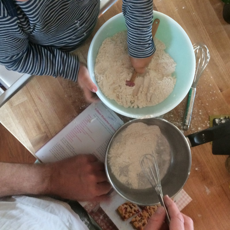 Little helpers mixing dry ingredients